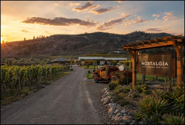 Nostalgia Wines entrance and Black Sage Bench vineyards glowing at sunset