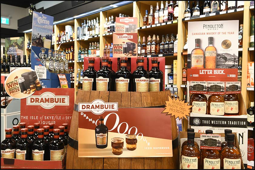 Drambuie bottle with a tumbler and a wall background